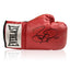 Red Everlast boxing glove signed by Barry McGuigan with black signature.