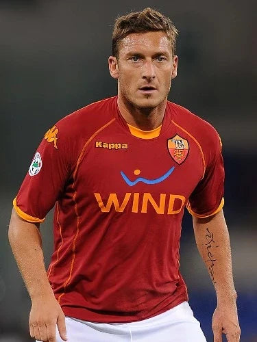 Francesco Totti wearing an AS Roma football shirt during a match.
