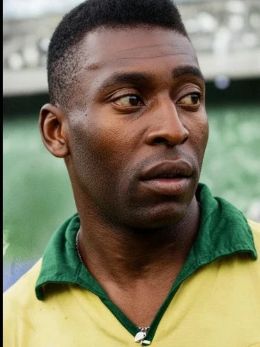 Portrait of Pele wearing a Brazil football shirt.