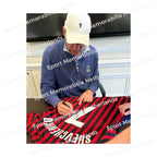 Signing proof of Andriy Shevchenko signing an AC Milan 2000 centenary shirt during a private signing session.