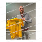 Signing proof of Bradley Wiggins with a signed yellow Tour de France cycling jersey during a private signing session.