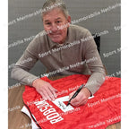 Signing proof of Bryan Robson signing an official Manchester United 1992-94 football shirt.