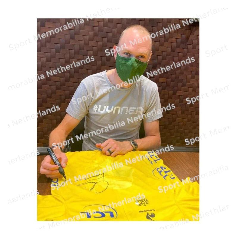 Signing proof of Chris Froome signing a 2013 Tour de France yellow cycling jersey during a private signing session.
