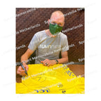 Signing proof of Chris Froome signing a 2013 Tour de France yellow cycling jersey during a private signing session.