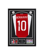 Framed Dennis Bergkamp signed Ajax 2024-2025 home football shirt displayed in a premium black frame by Sport Memorabilia Netherlands.