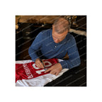 Dennis Bergkamp signing an Ajax 2024-2025 home football shirt during a private signing session for Sport Memorabilia Netherlands.