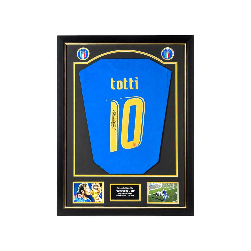 Framed Francesco Totti signed Italy 2006 number 10 football shirt with two photos and a central plaque.