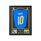 Framed Francesco Totti signed Italy 2006 number 10 football shirt with two photos and a central plaque.