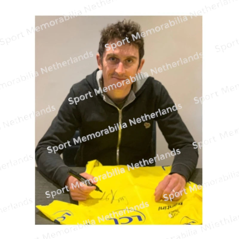 Signing proof of Geraint Thomas signing a yellow Tour de France cycling jersey during a private signing session.