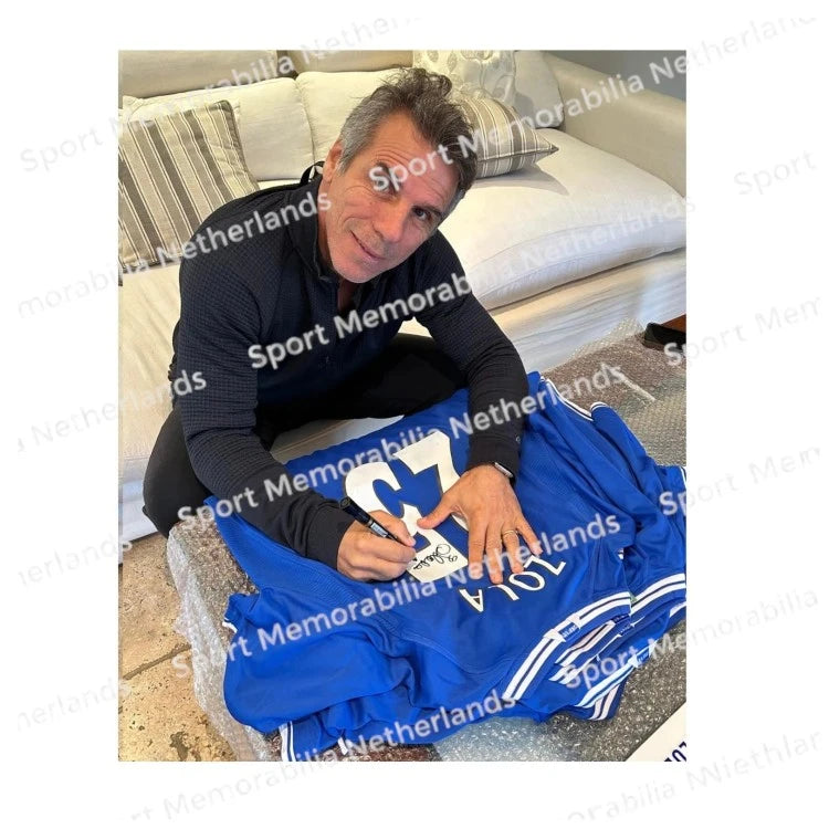 Signing proof of Gianfranco Zola signing an official Chelsea 2000 home football shirt during a private signing session.