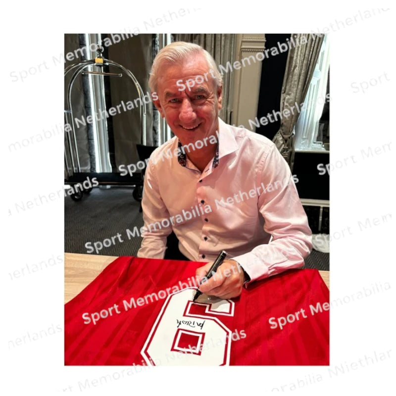 Signing proof of Ian Rush signing an official Liverpool 1985-86 football shirt during a private signing session.