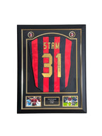 Framed Jaap Stam signed AC Milan 1988 replica number 31 football shirt with two photos and a central plaque.