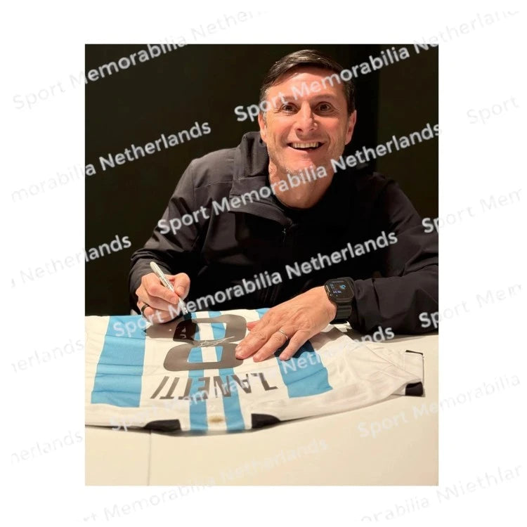 Signing proof of Javier Zanetti signing an official Argentina football shirt during a private signing session.