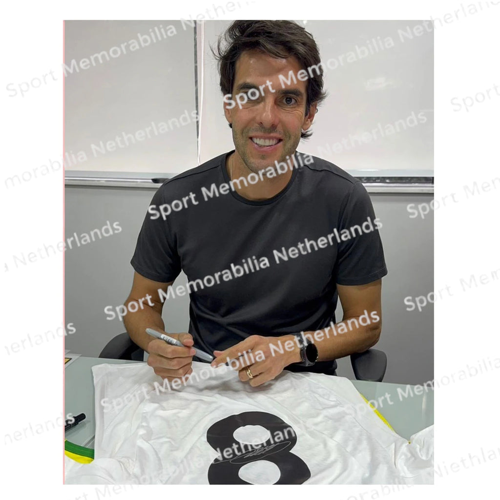Signing proof of Kaká signing an official Real Madrid football shirt during a private signing session.