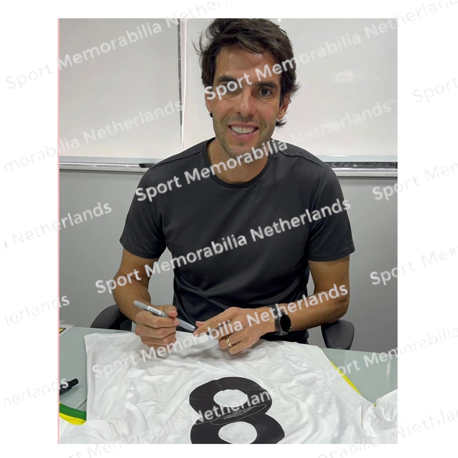 Signing proof of Kaká signing an official Real Madrid football shirt during a private signing session.