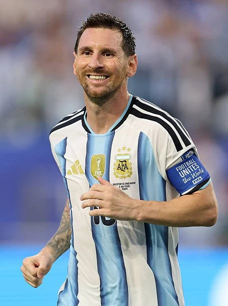 Lionel Messi wearing the official Argentina football shirt during an international match.