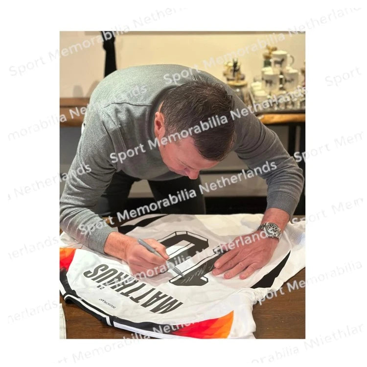 Signing proof of Lothar Matthäus signing an official Germany 2024 football shirt during a private signing session.