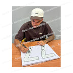 Signing proof of Luis Suárez signing an official Barcelona 2025-26 football shirt during a private signing session.