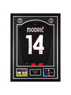 Framed Luka Modrić signed AC Milan 2025-26 home football shirt display with authentication hologram and player photos.