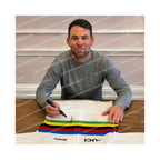 Signing proof of Mark Cavendish signing an official UCI World Champion rainbow jersey during a private signing session.