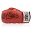 Red Everlast boxing glove signed by Mike Tyson and Frank Bruno with black inscriptions.