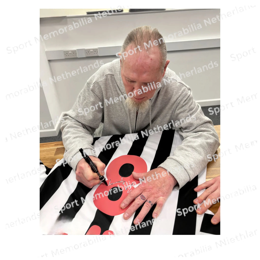 Signing proof of Paul Gascoigne signing a Newcastle United 1984 football shirt during a private signing session.