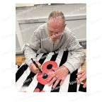 Signing proof of Paul Gascoigne signing a Newcastle United 1984 football shirt during a private signing session.