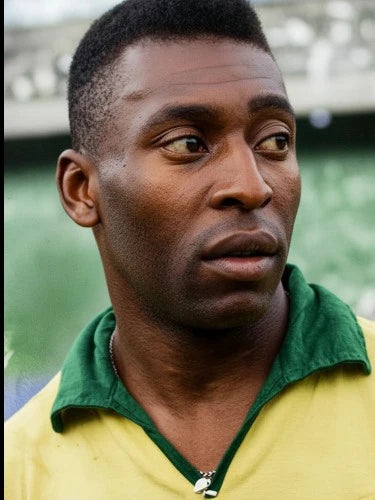 Portrait of Pele wearing a Brazil football shirt.