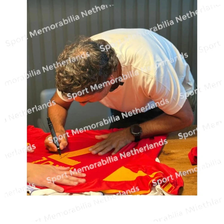 Signing proof of Raúl González signing an official Spain 2004-06 football shirt during a private signing session.