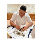 Ronaldo Luís Nazário signing a Real Madrid 2023-24 home football shirt during a private signing session 