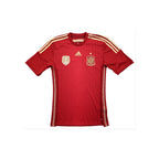 Voorkant van een rood Spanje Adidas voetbalshirt met nationaal embleem, FIFA World Champions 2010-badge en gouden details.