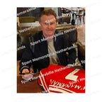 Signing proof of Steve McManaman signing an official Liverpool 1996-98 football shirt during a private signing session.