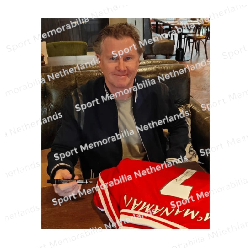 Signing proof of Steve McManaman signing an official Liverpool 1996-98 football shirt during a private signing session.