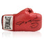 Red Everlast boxing glove signed by Sugar Ray Leonard with black signature and smiley face inscription.