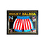 Ingelijste Rocky Balboa-boksbroek gesigneerd door Sylvester Stallone met filmfoto’s en gouden details.