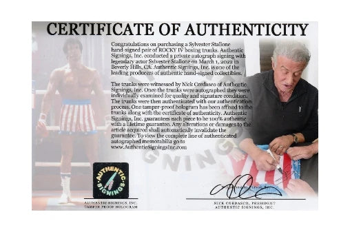 Certificate of authenticity for Sylvester Stallone signed Rocky IV boxing trunks with signing photo.