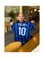 Wesley Sneijder holding a signed Inter Milan football shirt number 10 during a private signing session.